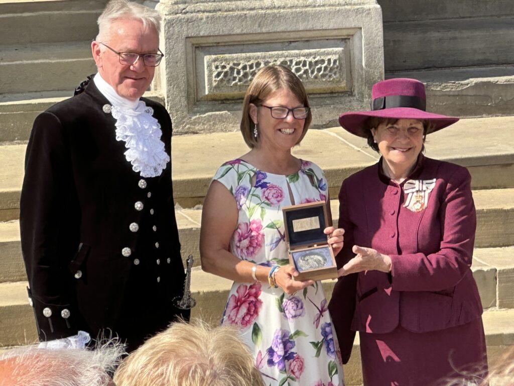 The Lord-Lieutenant presents Rebecca Crerar with The Suffolk Medal at Suffolk Day 2023